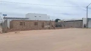 Terreno comercial con casa en obra negra en San Luis Río Colorado - Foto 1
